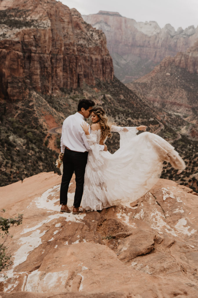 bride and groom in zion national park at Angels landing