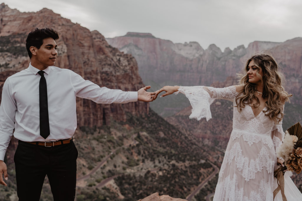 Bride and Groom in Zion National Park looking at eachother