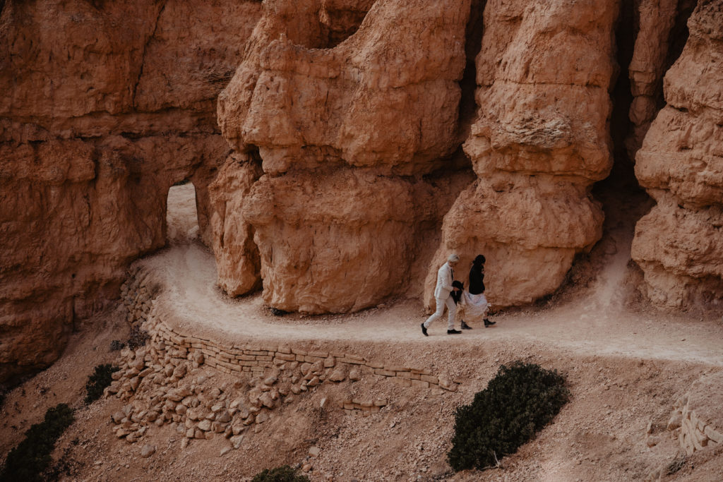 Bryce canyon National Park adventure hiking Elopement couple walks through the park together on their wedding day