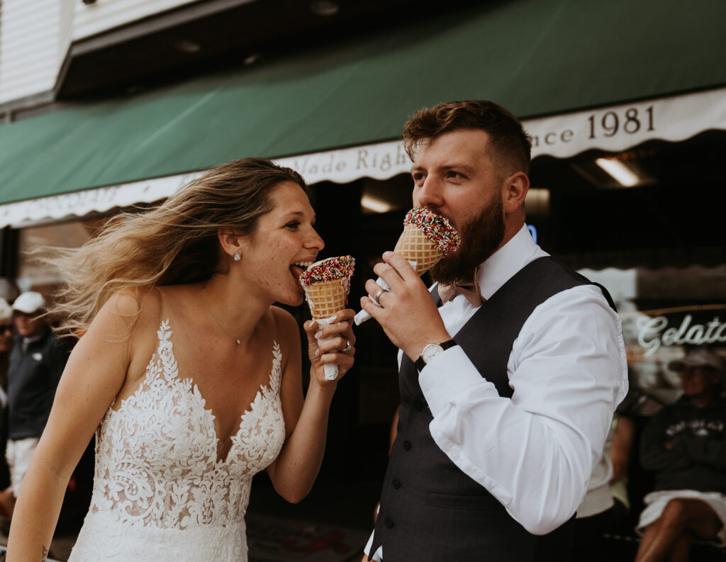 Bride and groom wedding Couple eating icecream cones after their elopement day, while still dressed in their wedding dress and suit.