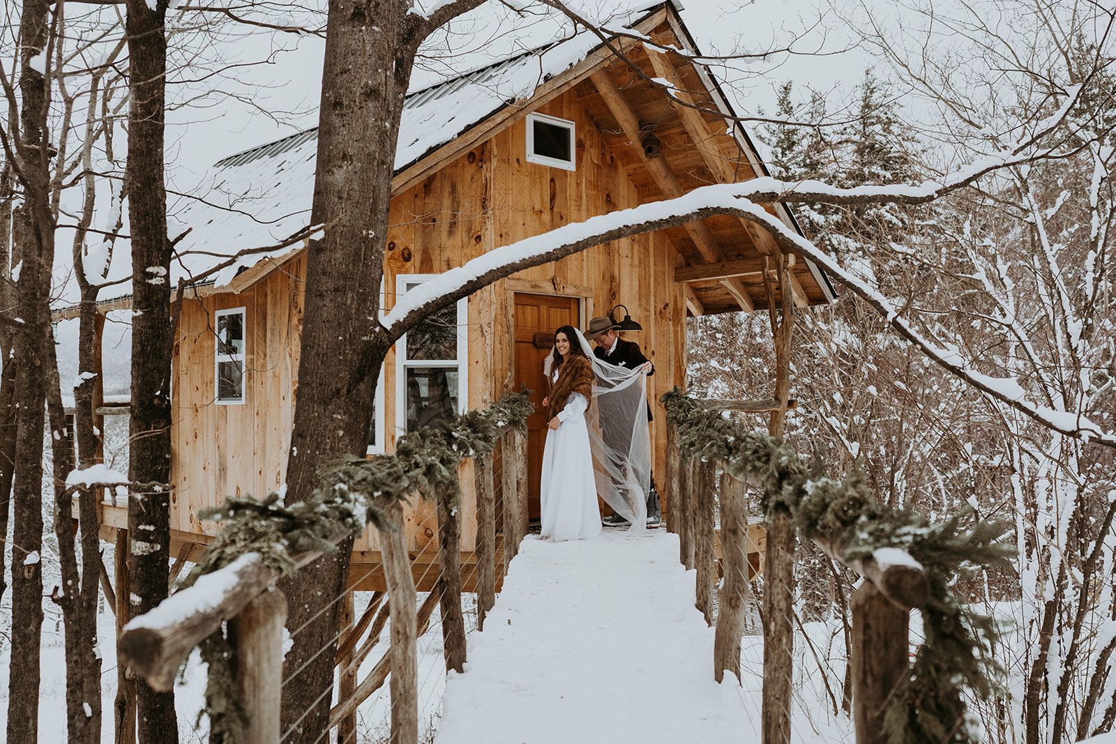 Bride and Groom Preparing for their Snowboarding Elopement