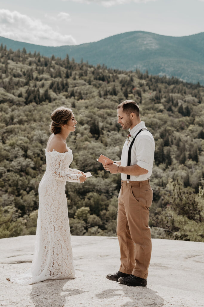 Bride and groom exchange vows on a mountain top during their summer New England Elopement. 